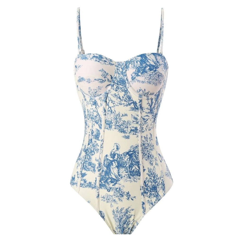 Blue women's one-piece polyester swimsuit with matching gauze skirt laid flat