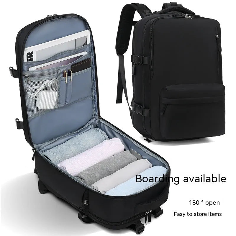 Large black waterproof mummy-style travel backpack on a neutral background.