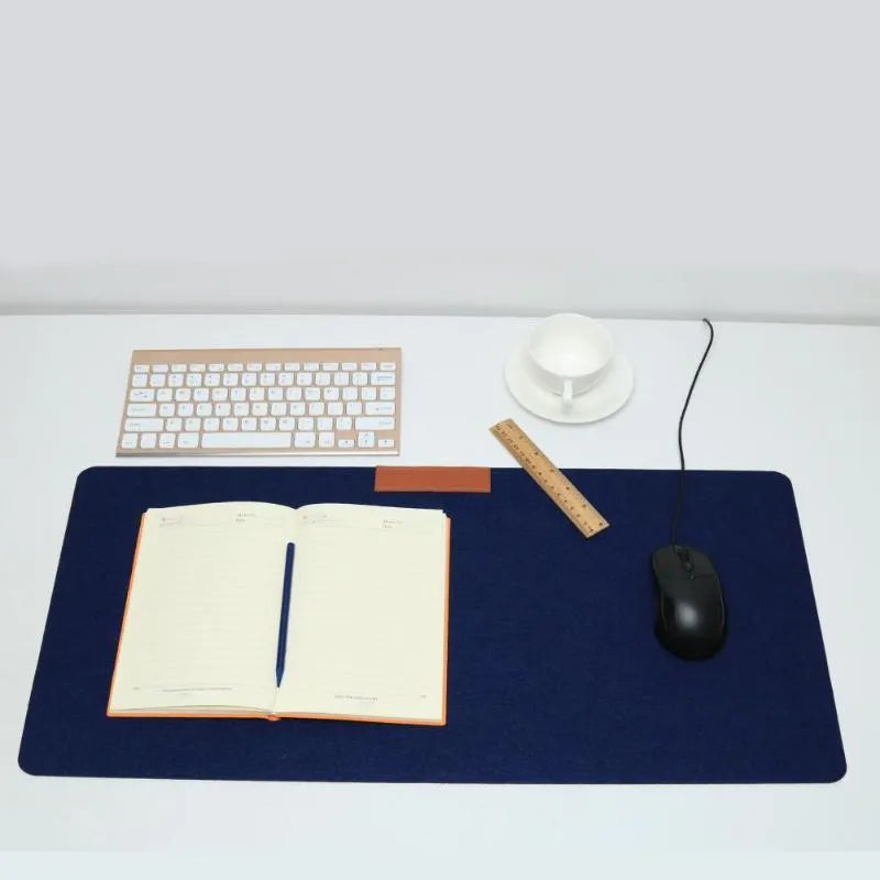 Large felt mouse pad in black on office desk with keyboard and mouse, 325x635mm