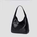 Women's soft PU leather retro shoulder bag in black with single strap and open pocket.