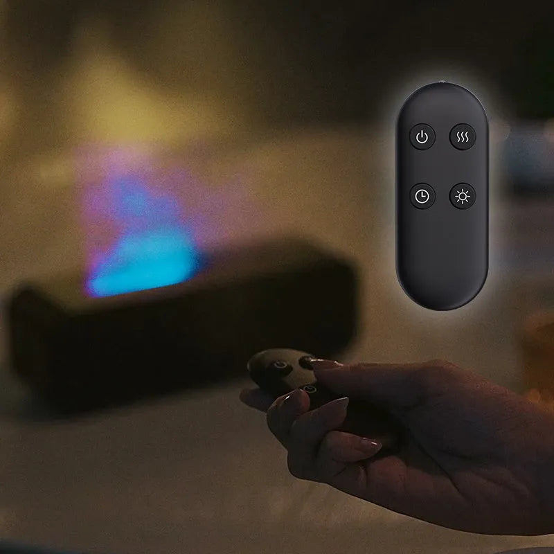 Black and white aroma diffuser with remote control showing colour-changing flame light effect
