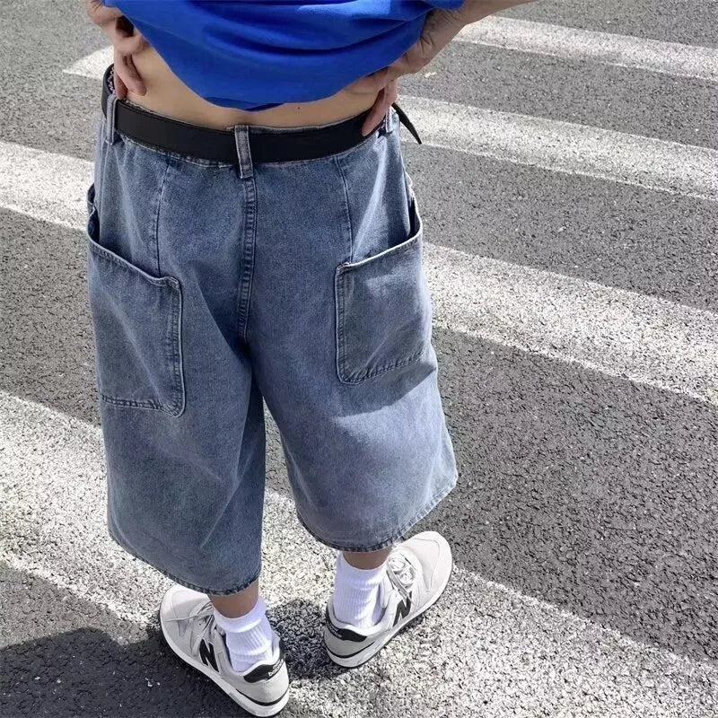Blue high-waisted men's denim pirate shorts with a cropped length and straight-leg silhouette on a white background.