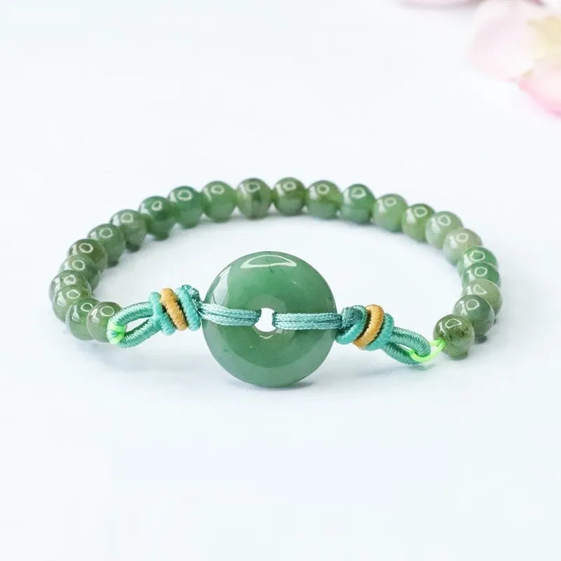 Jade bracelet with safety buckle showing emerald green 6mm star beads in national style design