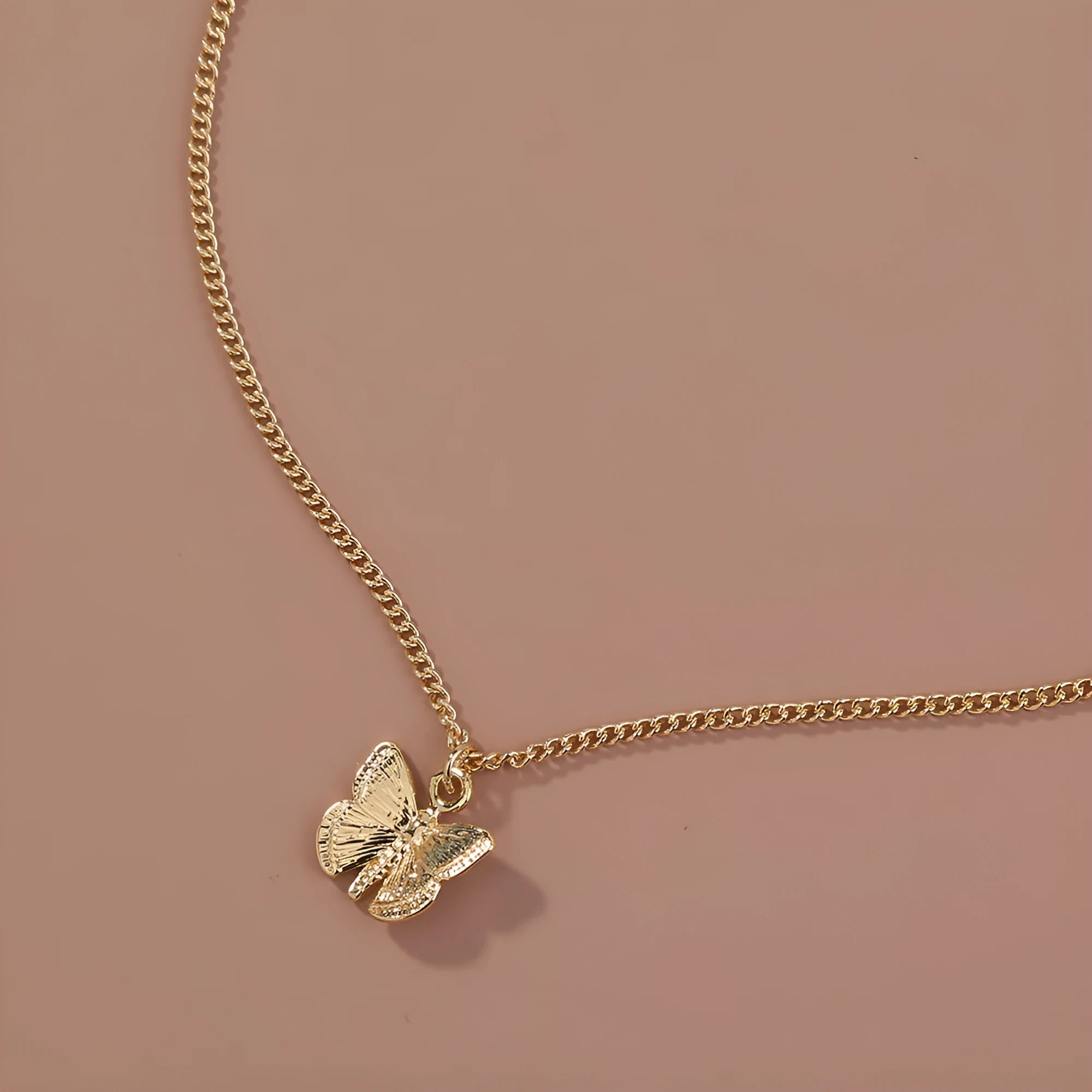 Gold-tone butterfly pendant necklace on a 45cm chain with zinc alloy and electroplate finish