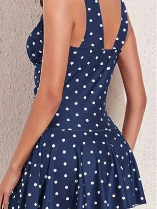 Blue polka dot print women's plus size bikini swimsuit on a hanger