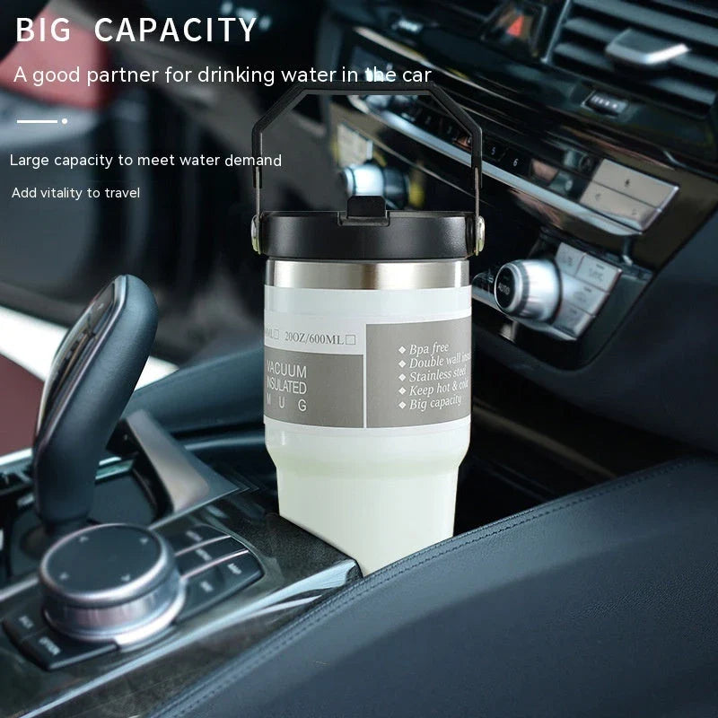 Insulated stainless steel travel tumbler with double-wall vacuum technology, sweat-proof powder coating, and BPA-free sliding lid for hot and cold drinks on the go.