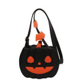 Horizontal view of a PU crossbody bag with pumpkin and bat cartoon design in orange colour option.