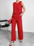 Red polyester two-piece set showing sleeveless top and wide leg trousers on Asian size mannequin