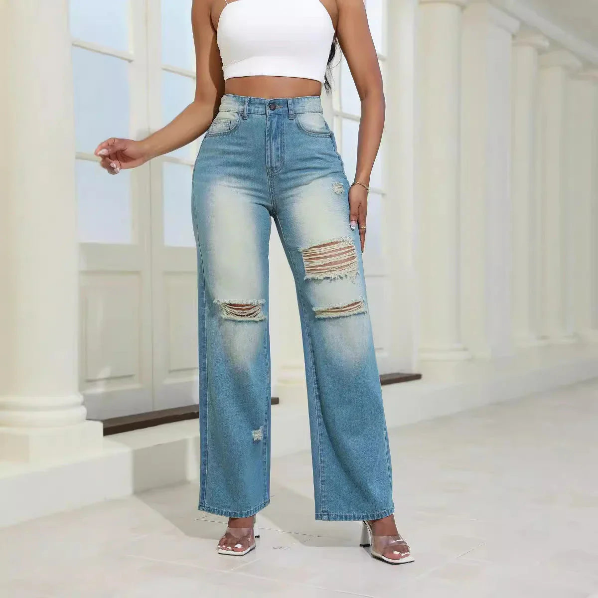 Fashionable high-waist ripped jeans with pockets, made from premium denim and artificial silk blend for comfort and style.