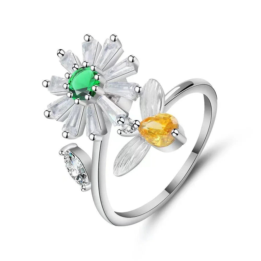 Adjustable rotating spinner ring with elegant flower and bee design in various color options
