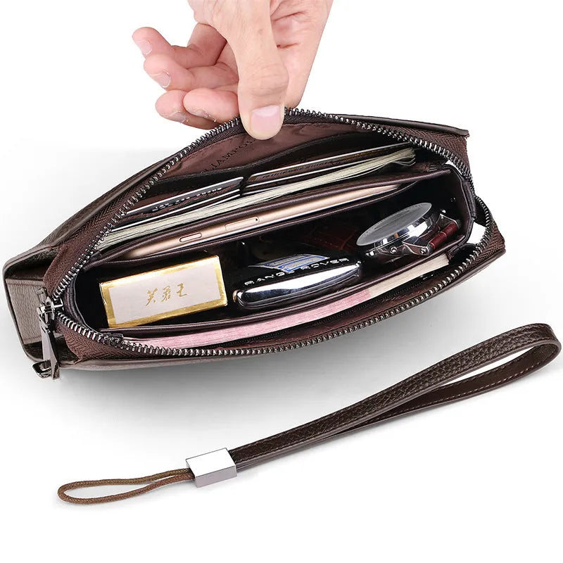 Men's black genuine leather wallet clutch open showing multiple card slots and compartments