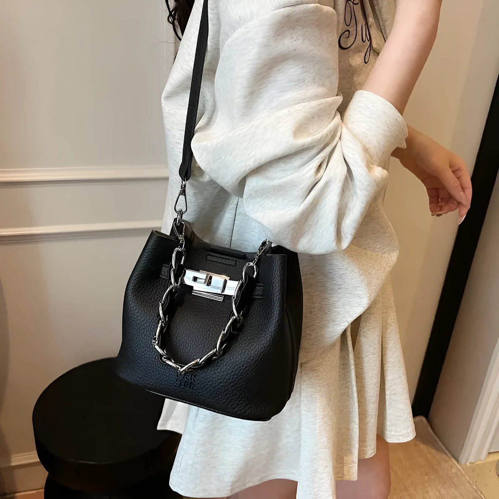Soft PU leather retro bucket shoulder bag with chain detail in four colour options.