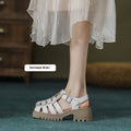 Women's retro platform sandals with chunky heel, closed round toe, and buckle strap in black and beige.