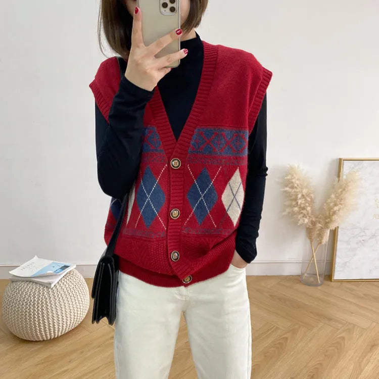 Khaki diamond plaid sleeveless cardigan on a hanger, showing loose fit and open front.