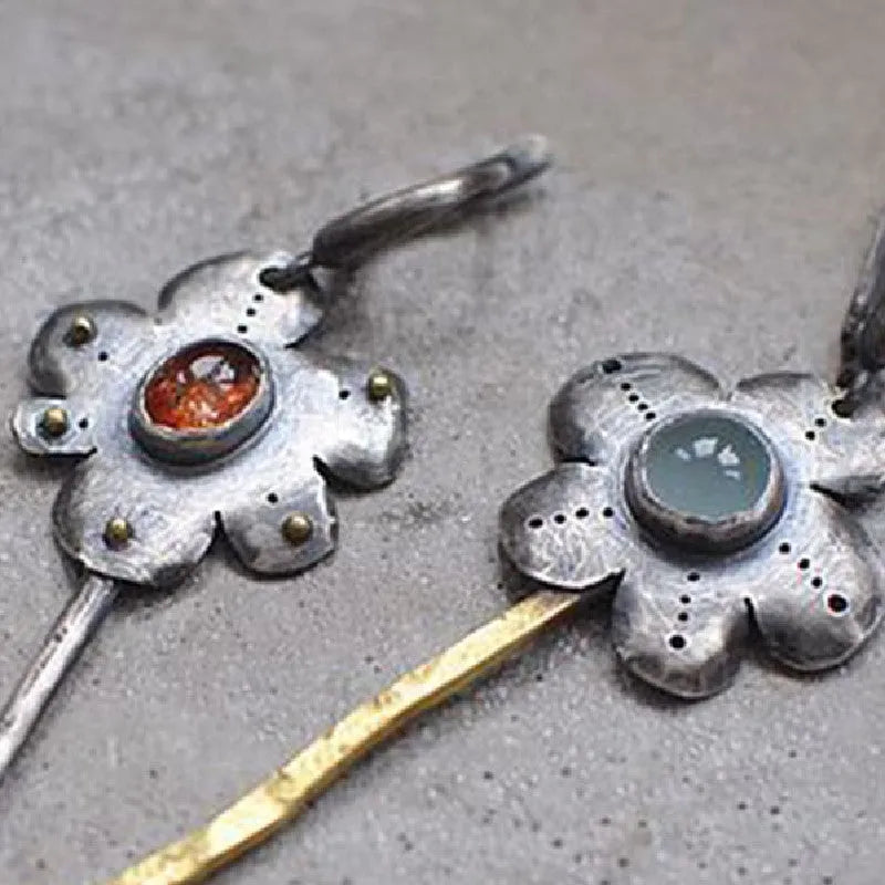 Long geometric flower earrings with retro styling and asymmetric two-colour electroplated finish