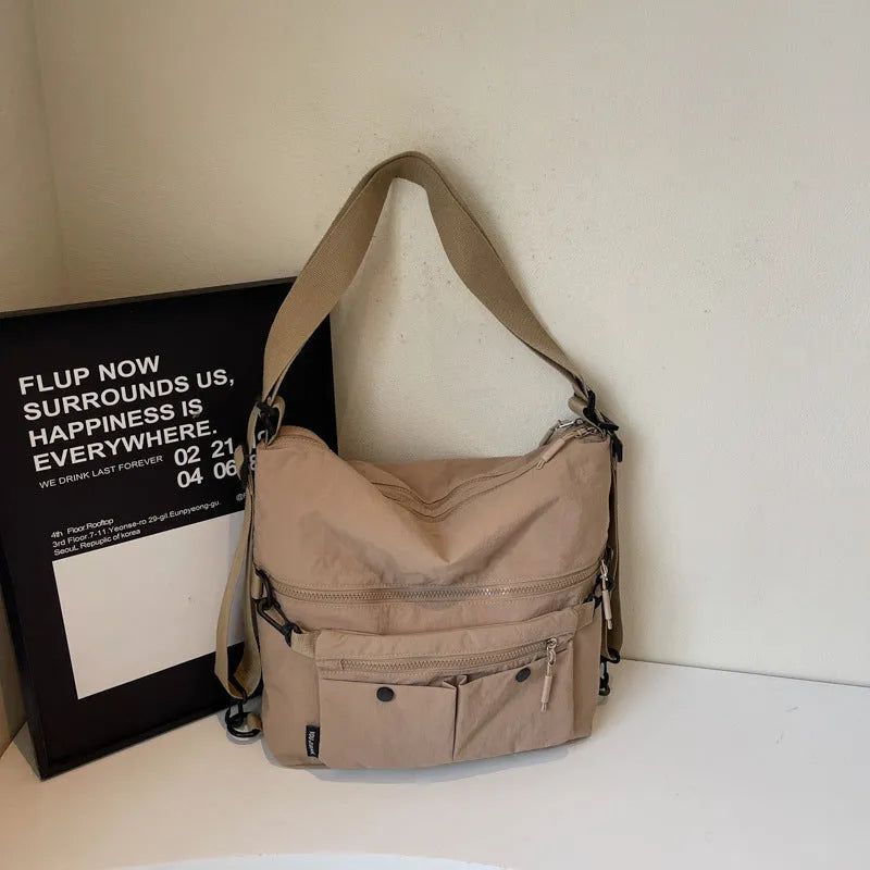 Women's nylon crossbody bag in square vertical shape with double shoulder straps and three-dimensional pockets