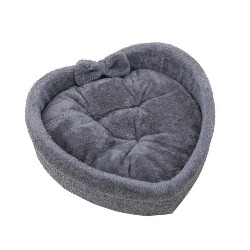 Heart-shaped pet nest for cats or small dogs made of linen and Arctic wool available in grey and pink in three sizes