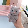 Cute cat sister doll soft plush 10cm tall with yellow eye beads on a table