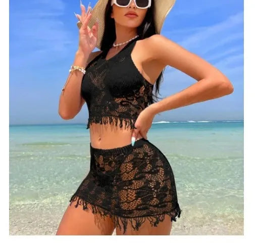 Women's black and white two-piece bikini swimsuit set with lace cover-up skirt