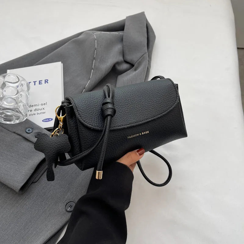 Soft PU leather small shoulder bag in khaki, pillow shape, 21cm width, with visible sewing thread details