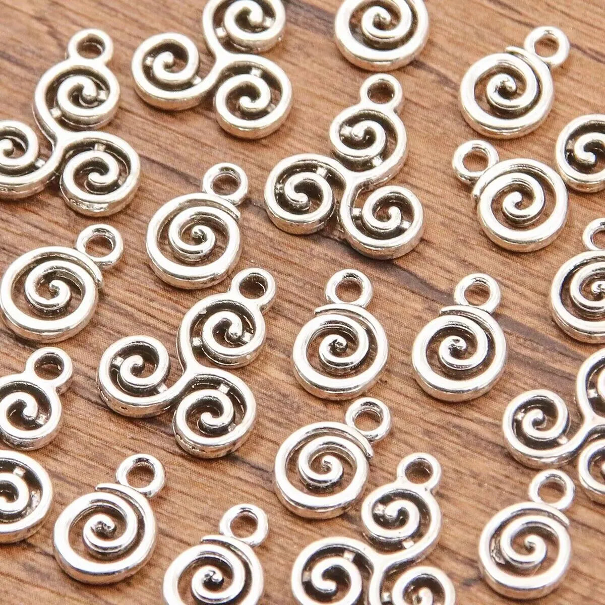 Double-sided hollow circle pendant in alloy with electroplated finish, simple round style, 7x11mm size on white background