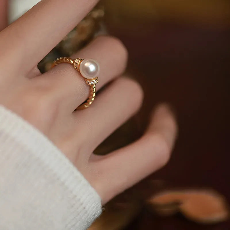 Adjustable antique twist pearl ring in copper with geometric shape and gold silver finish options.