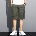 Men's camouflage 5-point workwear shorts in green, front view, with drawstring waist and mid-thigh length