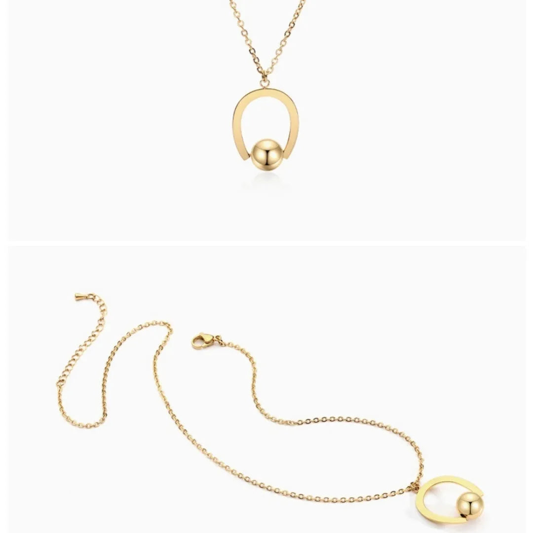 Stainless steel necklace with geometric pendant on a cross chain, shown in gold colour.