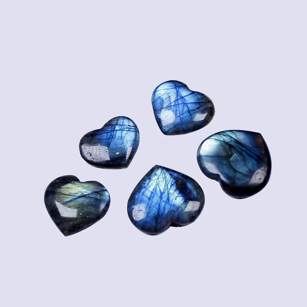 Natural blue pulled feldspar heart pendant with a handle detail on a white background.