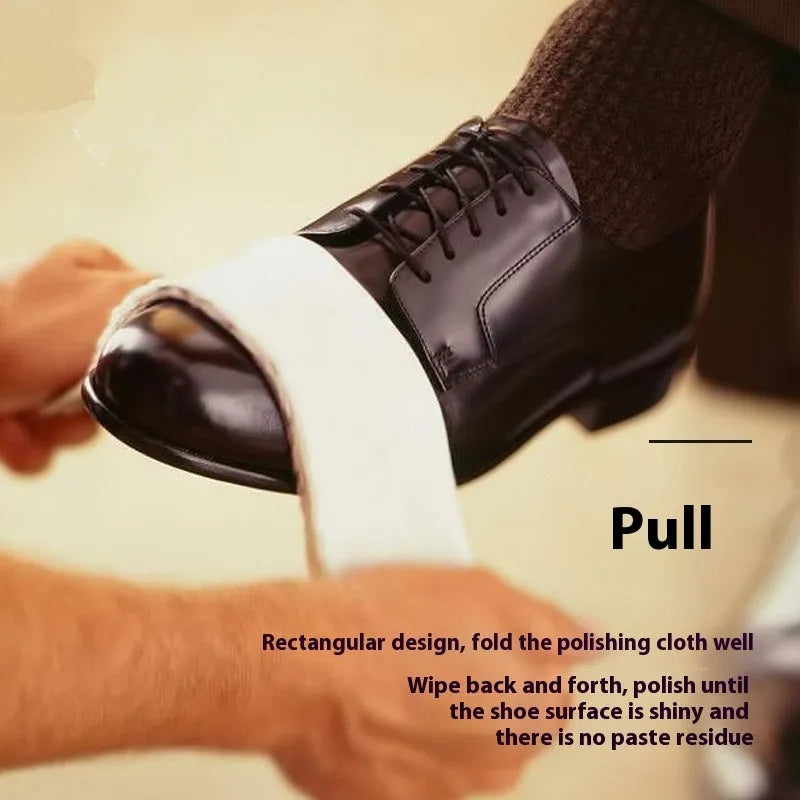 Cotton cleaning and polishing cloth 13 x 50 cm for shoe care, light colour, on a wooden surface