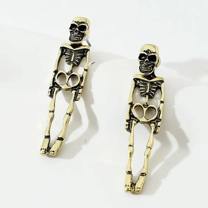 Halloween skull stud earrings in gold and silver with detachable design