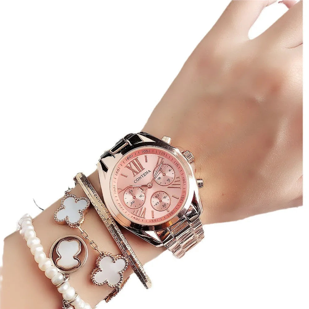 Women's silver rose gold diamond quartz analogue watch with mesh strap on wrist