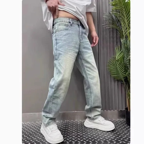 Light blue straight slim denim trousers for teenagers with mid-rise waist and zipper fly closure