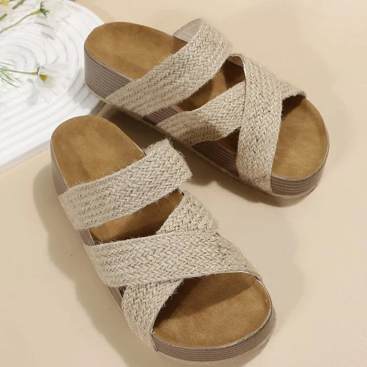 Women's woven cross-strap platform sandal in beige with PU upper and rubber sole on a flat surface
