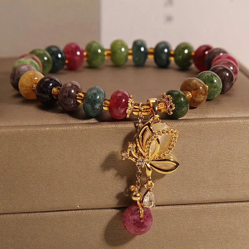 Colourful alloy bracelet for women with a butterfly charm and tourmaline beads on a fresh sweet style band.