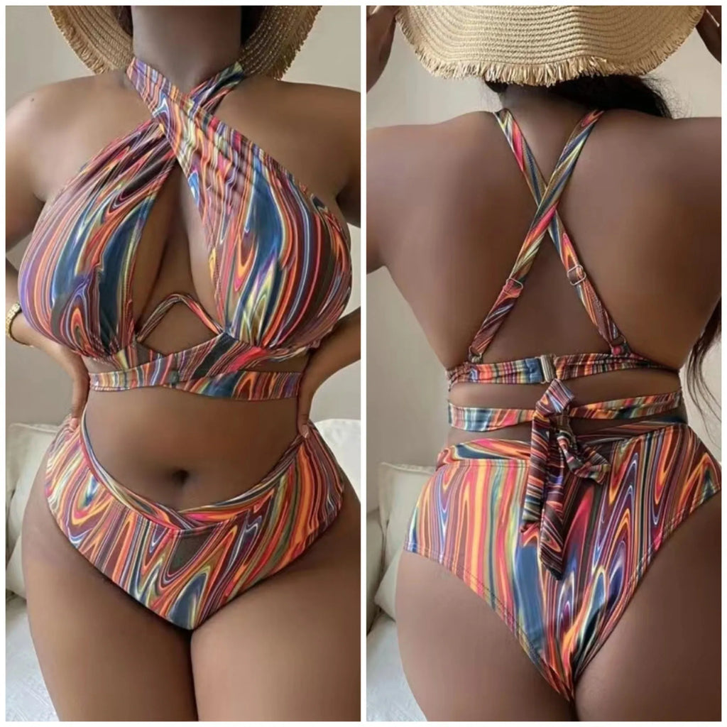 Women's floral print high-waisted bikini swimsuit with split sides.
