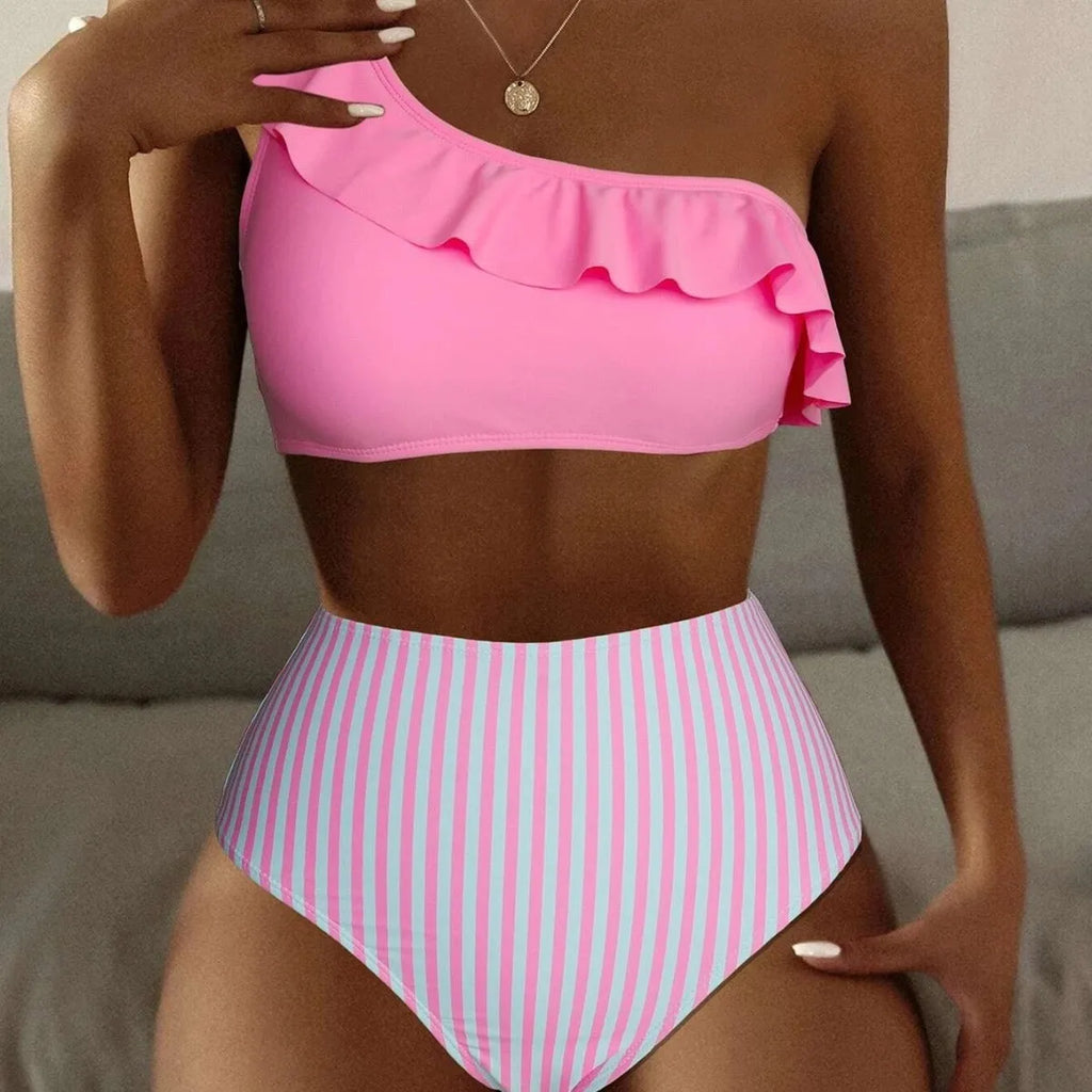 Women's striped and solid colour block bikini swimsuit on a hanger, shown in lavender purple.