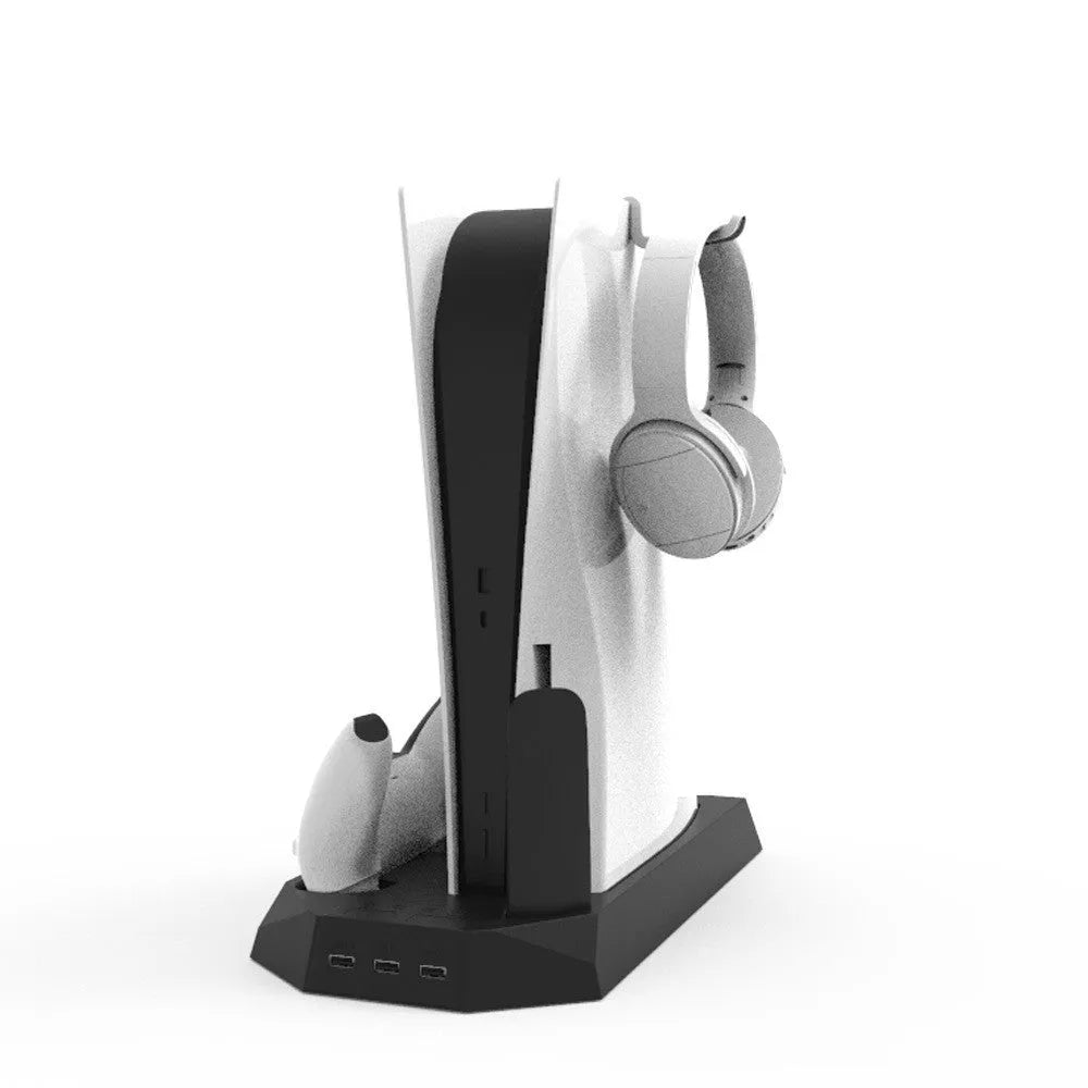 Black PS5 charging and cooling base station next to a PS5 console and controller