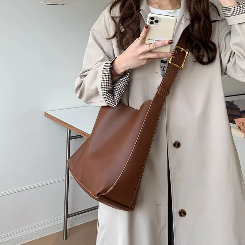 Women's solid colour PU leather shoulder bag in black, square vertical shape with sewing thread detail and single strap