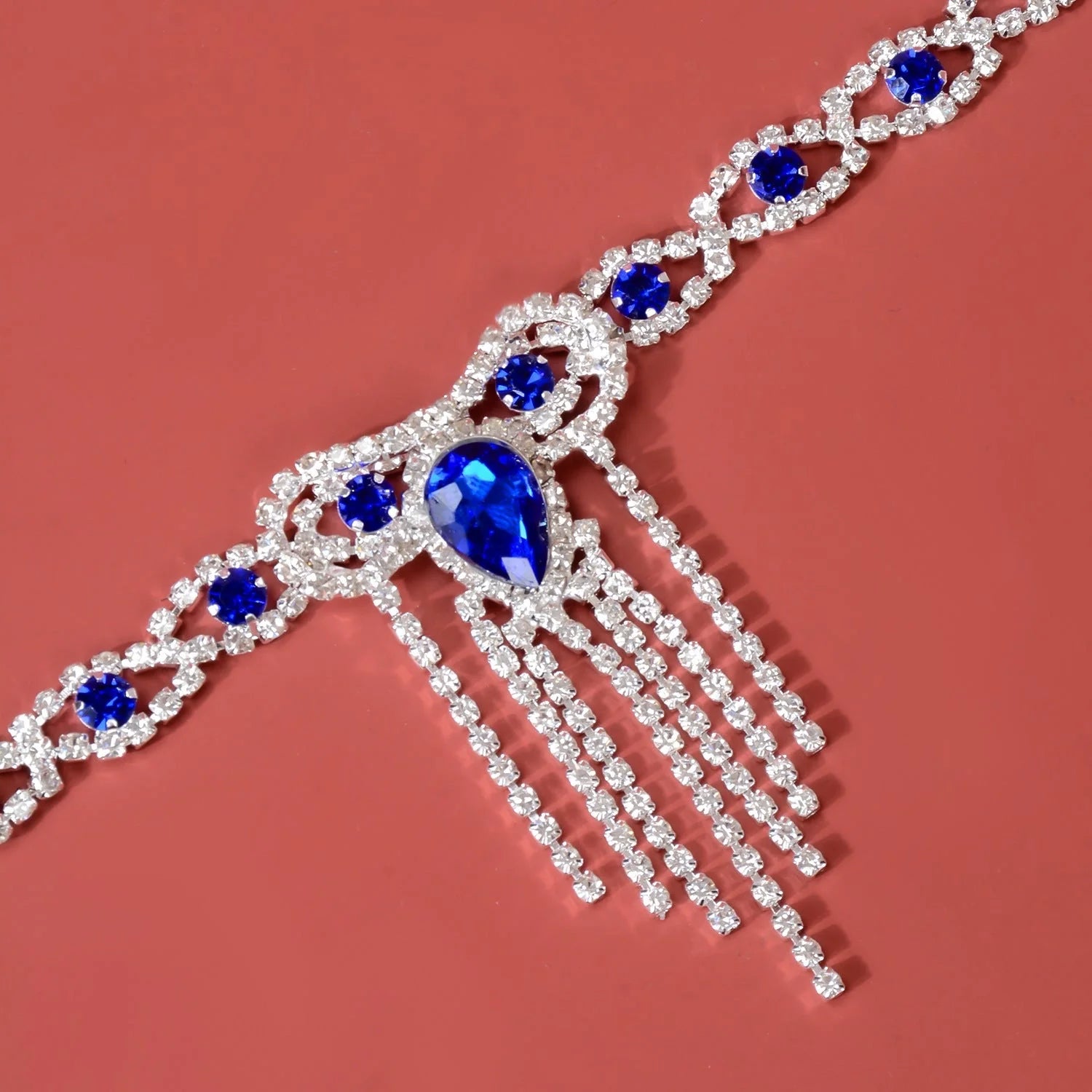 Blue rhinestone tassel anklet with gold-plated accents and semi-precious stones