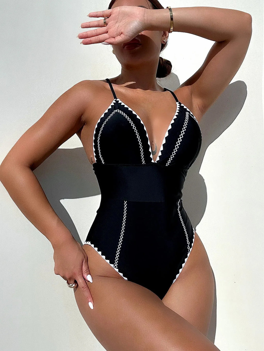Black one-piece women's swimsuit with nylon spandex fabric, sleeveless, solid colour, available in sizes S M L