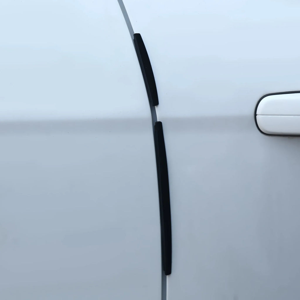 White plastic car door edge protector bumper strip set on a car door.