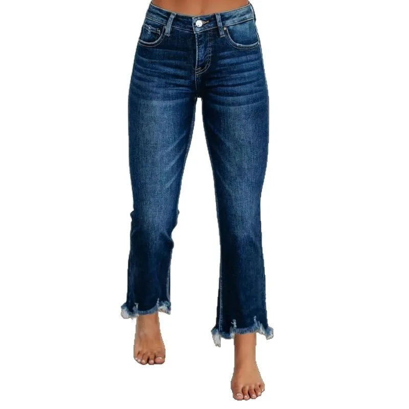 Women's solid colour denim jeans with a hand-worn distressed finish in dark blue.