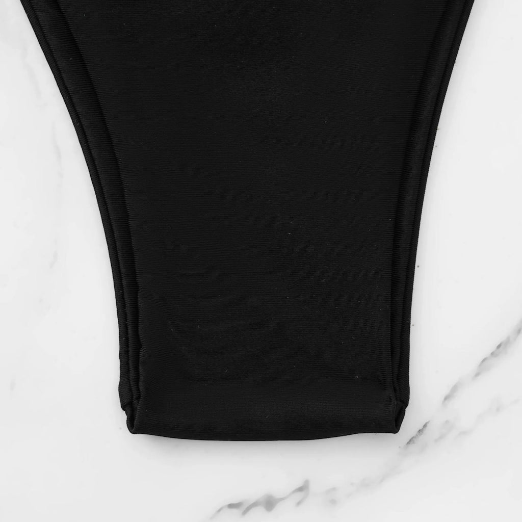 White female split swimsuit set with backless design and high elasticity, nylon lining