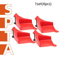 Four red plastic triangular parking blocks for car tyre stopping and vehicle positioning