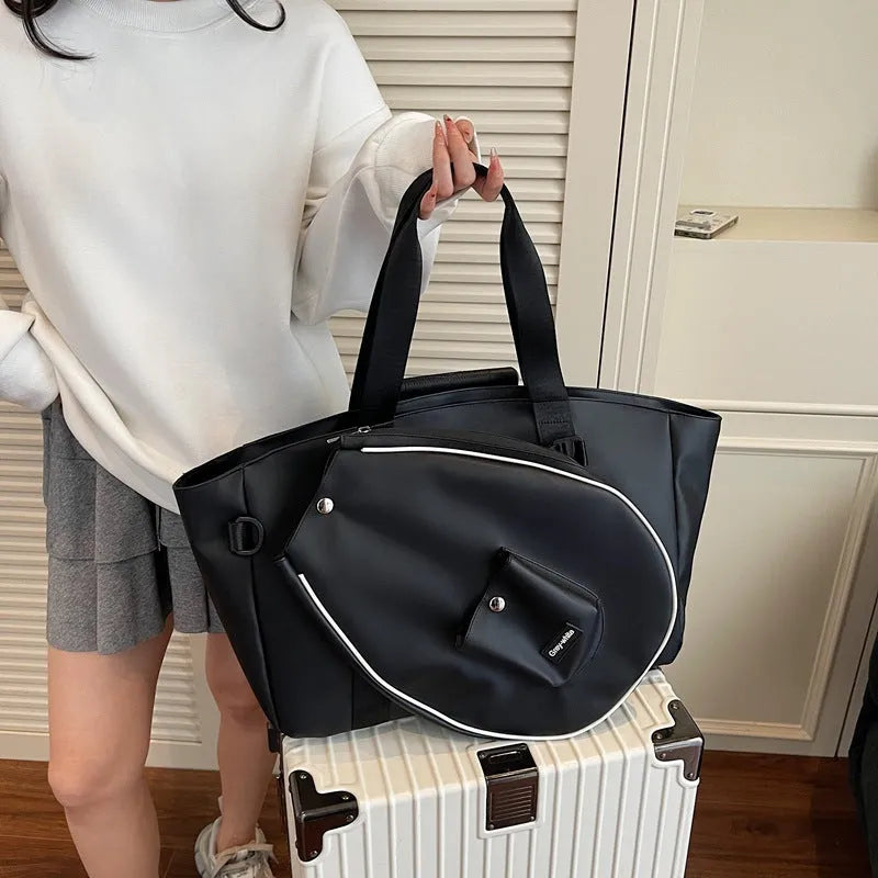 Black one-shoulder yoga storage bag with large main compartment and breathable lining