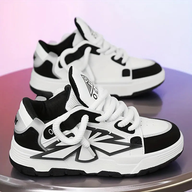 Men's white chunky sneakers with a cartoon totem pattern, thick rubber sole, and lace-up closure.