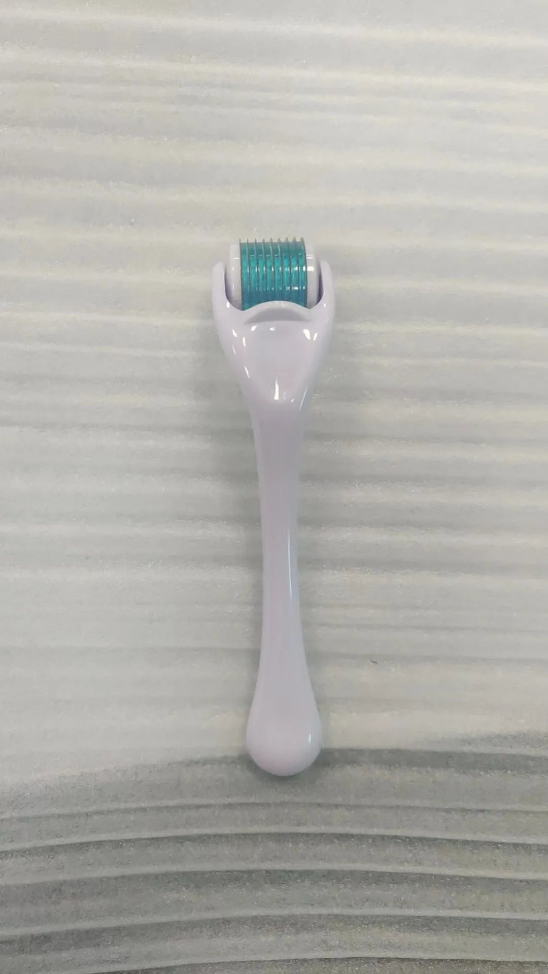 540 needle microneedle derma roller with colour wheel on black handle, showing 0.25mm specification.