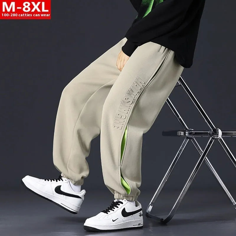Men's grey green loose fit jogger pants with elasticated ankle bands and waist.