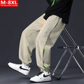 Men's grey green loose fit jogger pants with elasticated ankle bands and waist.